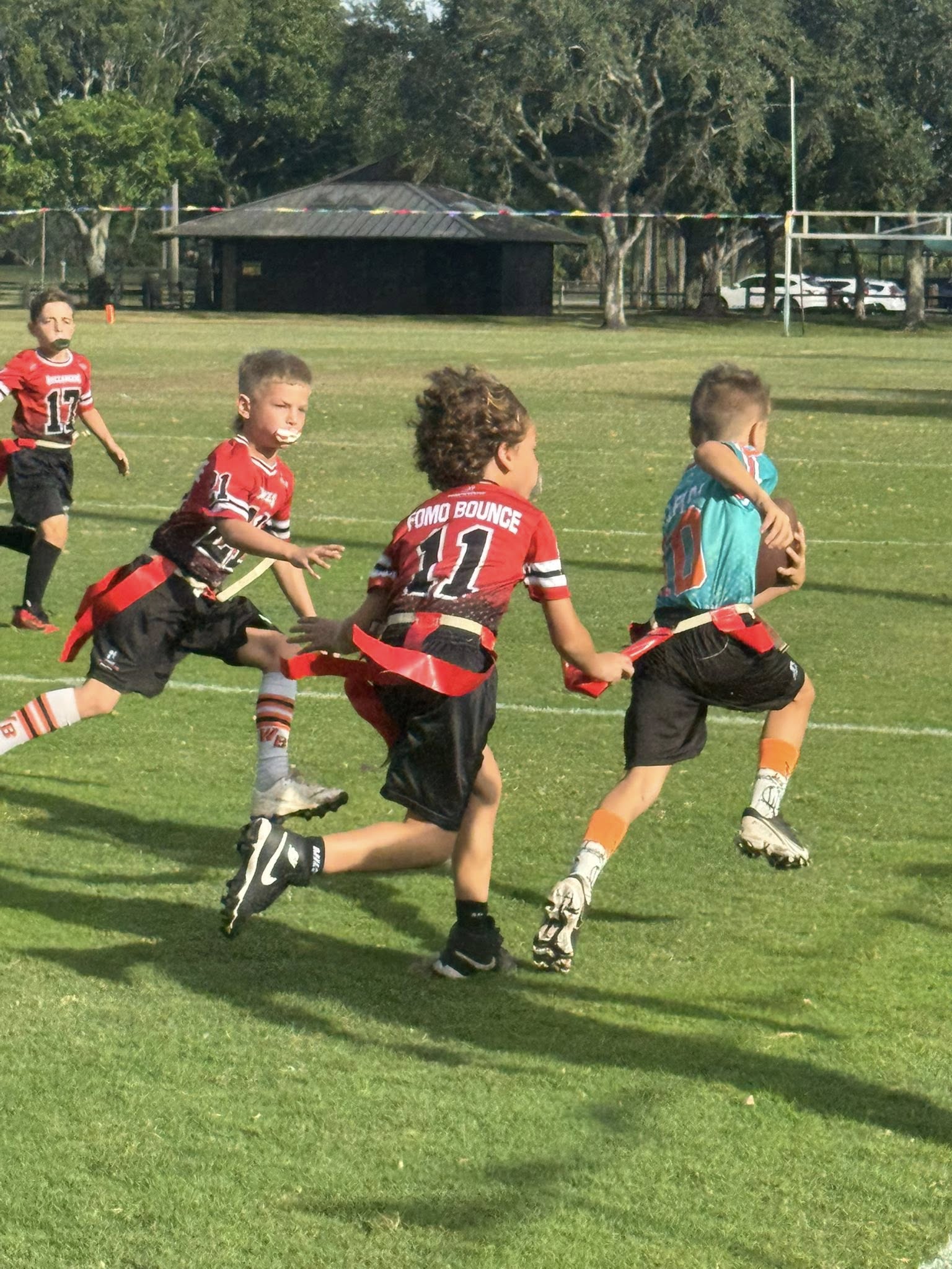 Game 1 youth flag football action